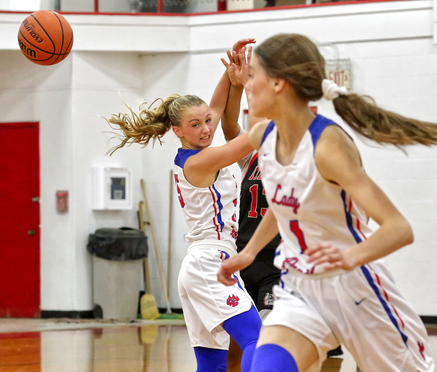 Lady Panther Bella Crawford deflects a Kilgore pass, as teammate Crimson Bryant moves in to secure the loose ball.